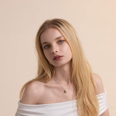 Model Wearing a 12.0mm White Freshwater Pearl Pendant - De Blancas