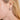 Model wearing an elegant earring featuring a loose natural silver Akoya pearl   - De Blancas